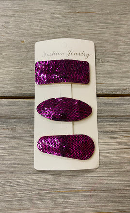 Purple felt backed snap clip set on card